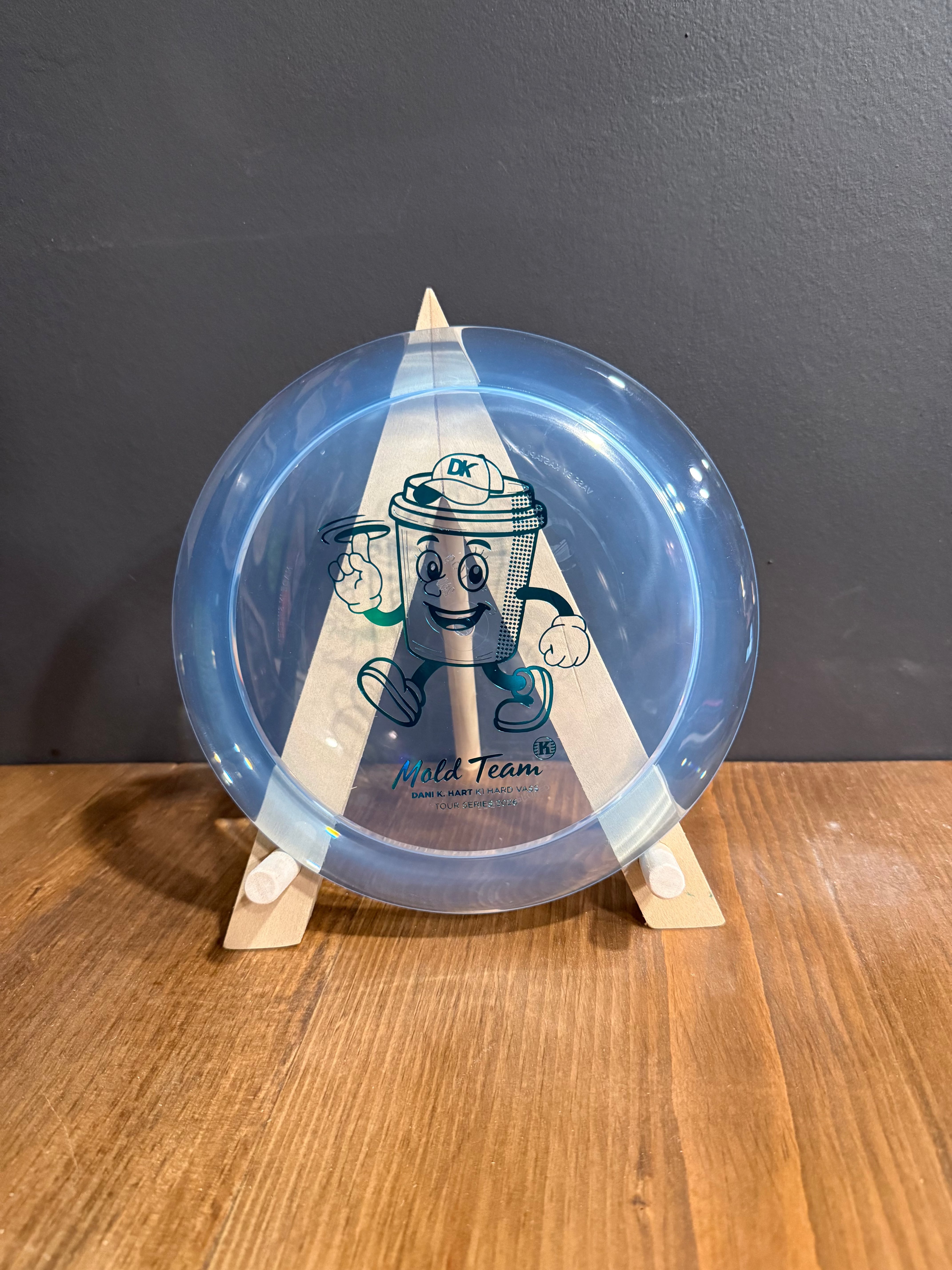 K1 Hard Vass blue translucent disc in smooth plastic, featuring a central cartoon character and Dani K. Hart branding