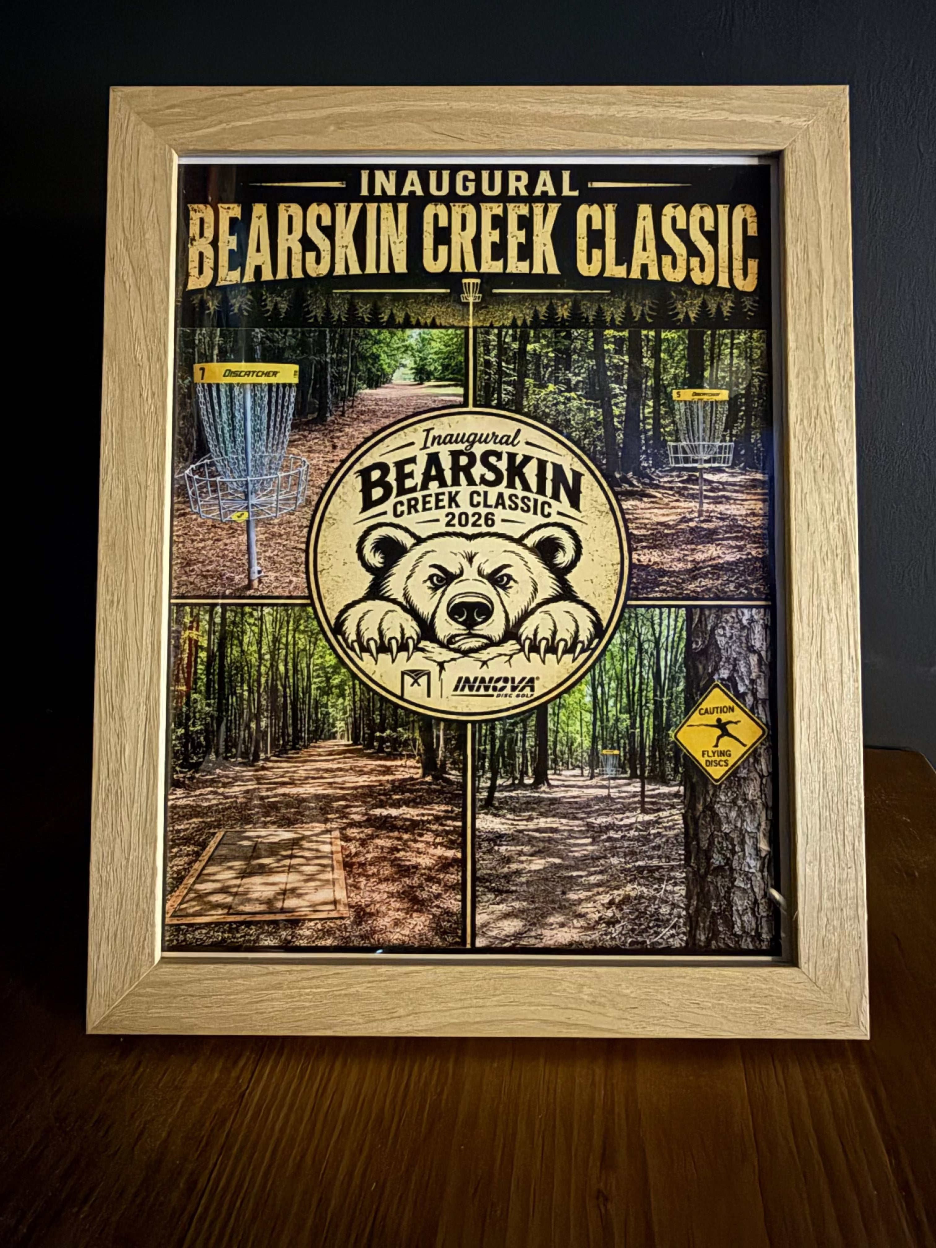 Custom Framed Pictures featuring a wood frame and Bearsikin Creek Classic disc golf course poster with bear emblem