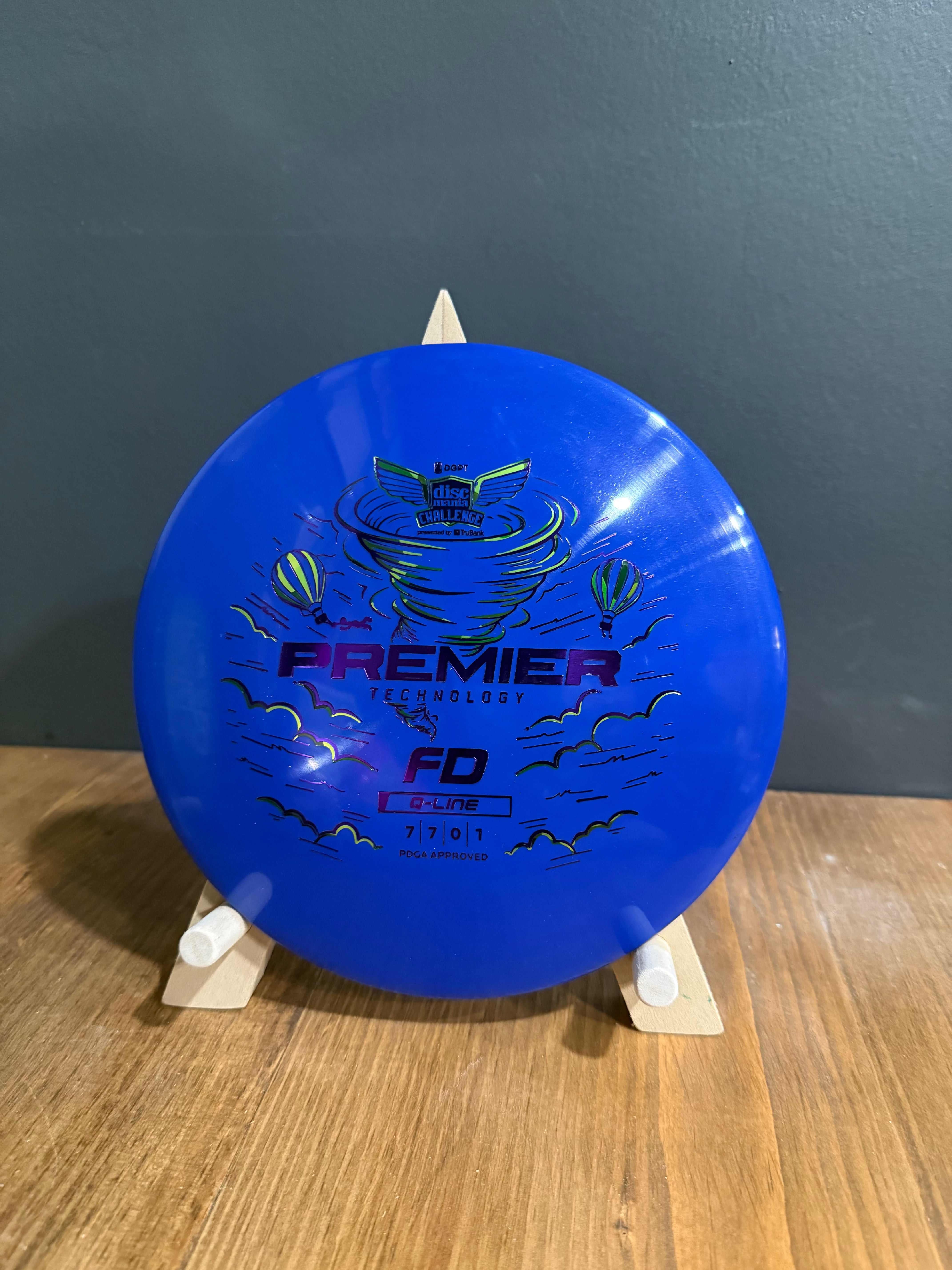 Q-Line Premier FD blue plastic disc with Premier-themed hot air balloon graphic and FD stamp