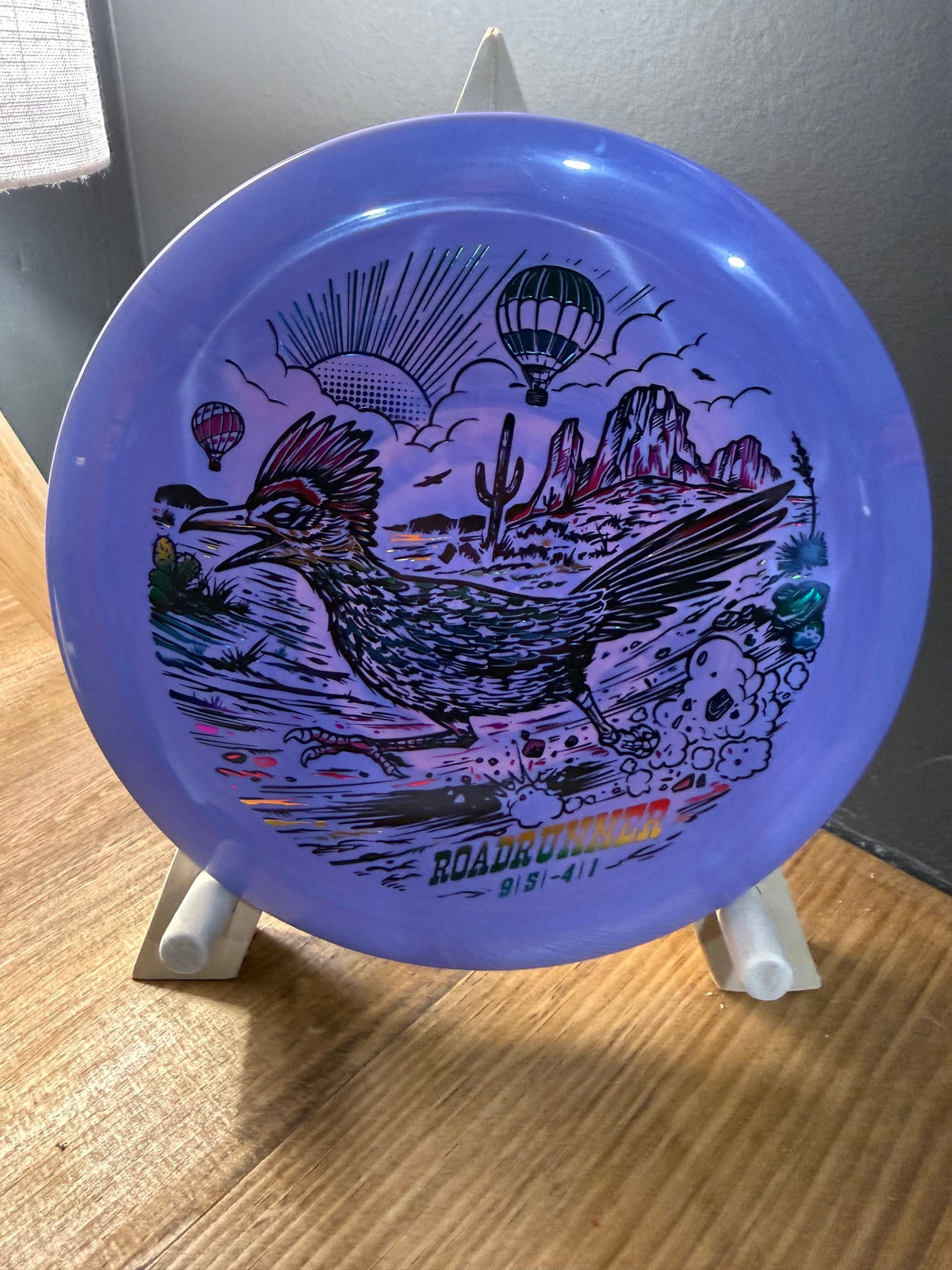 Swirly Star Roadrunner disc in vibrant purple plastic, featuring Wild West roadrunner artwork and desert scenery