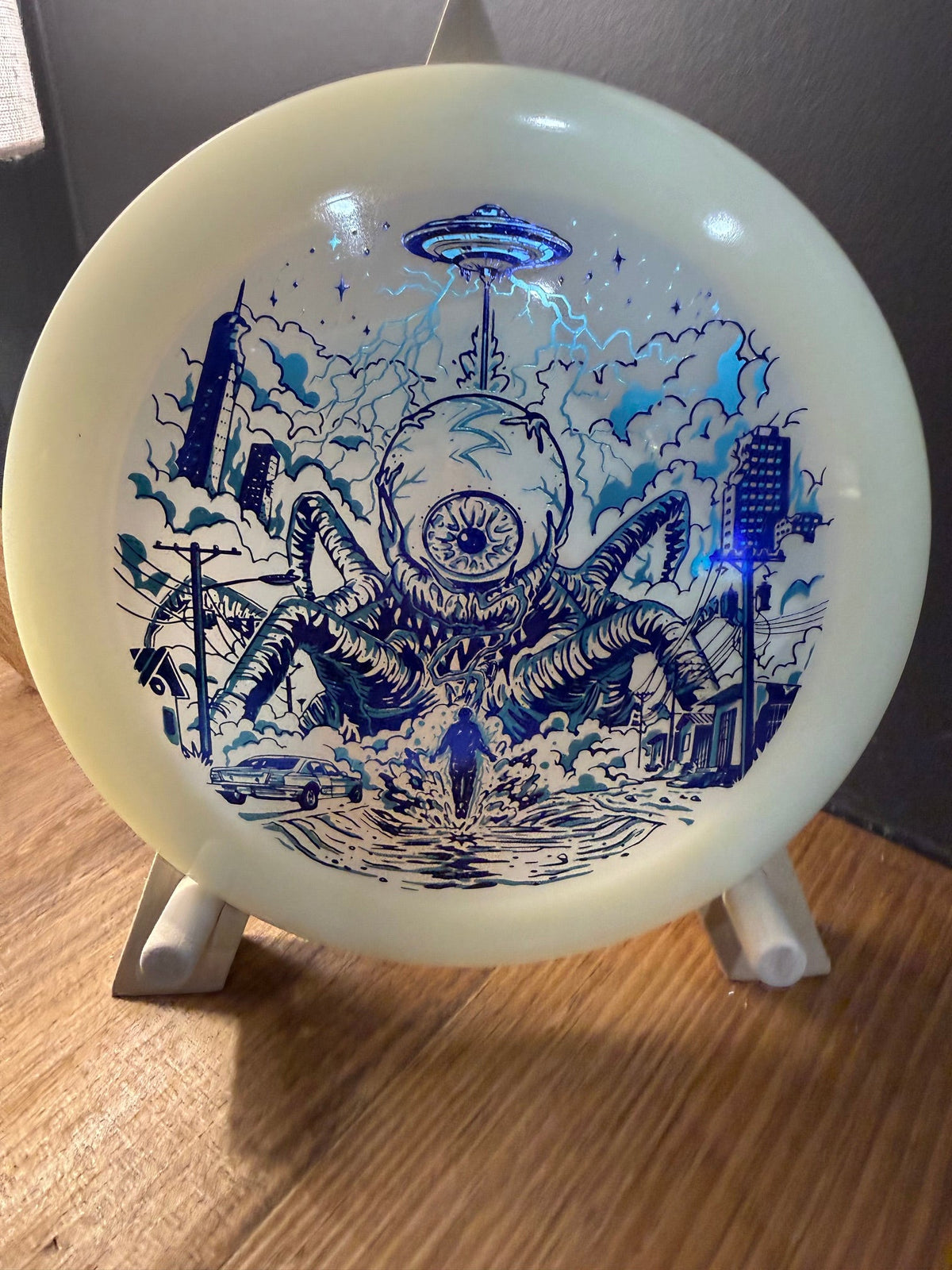 Glow Champion Destroyer of Worlds disc in translucent glow plastic with blue alien invasion artwork stamp and domed profile