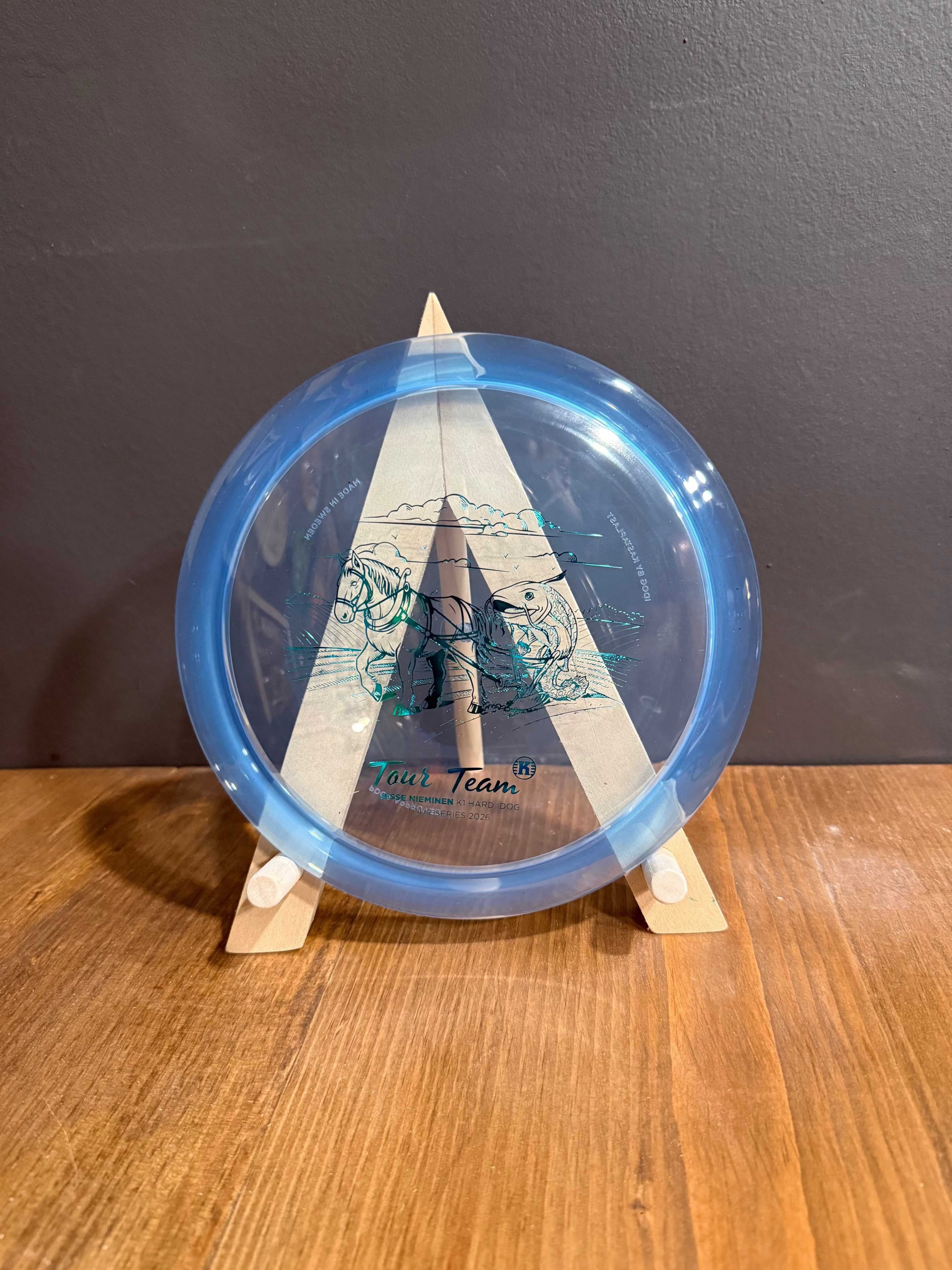 K1 Hard Idog blue translucent disc with Jesse Nieminen Tour Series graphic and triangular design 
