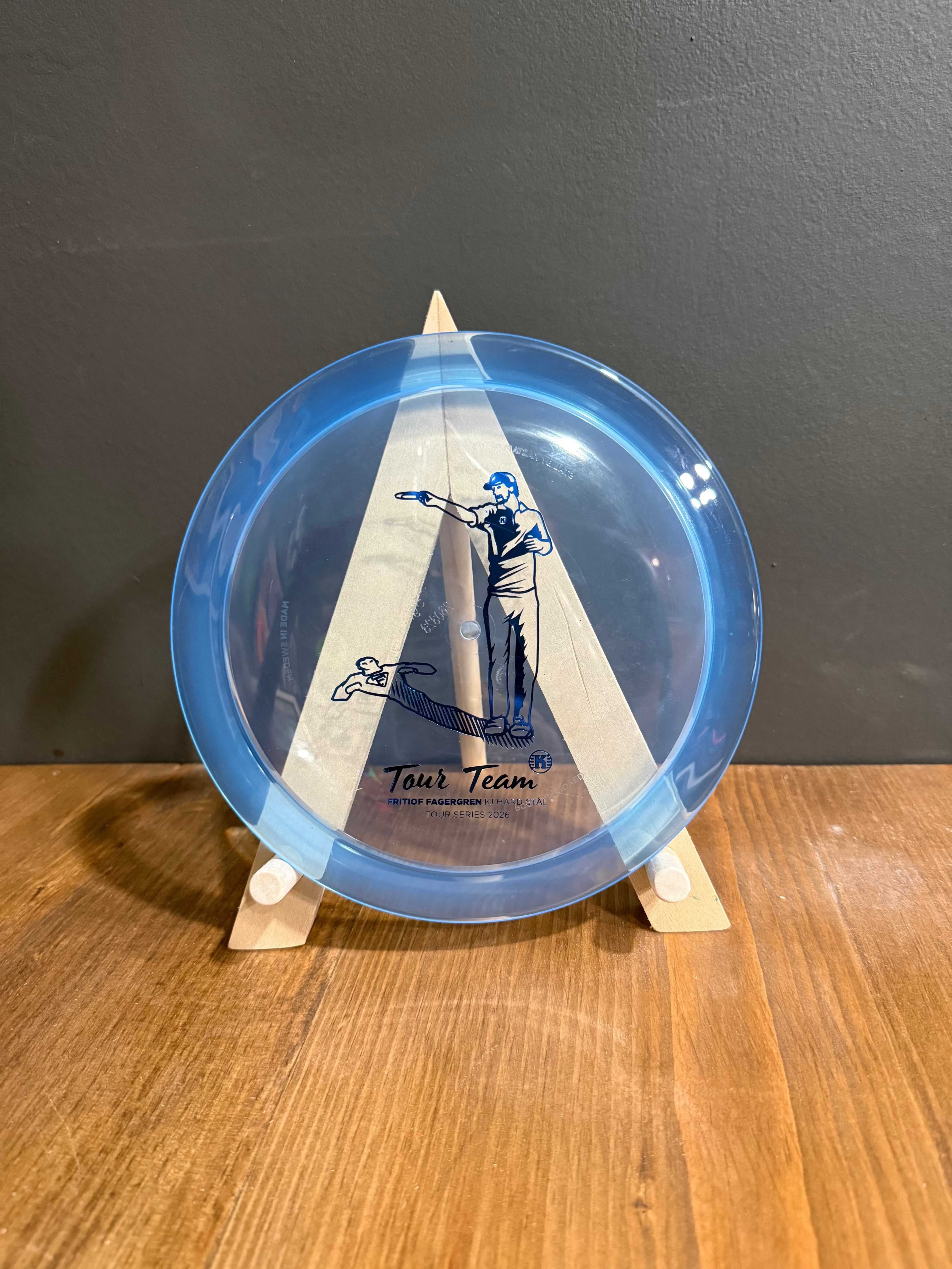 K1 Hard Stal blue translucent disc golf driver with Fritiof Fagergren Tour Team golfer graphic and text pattern