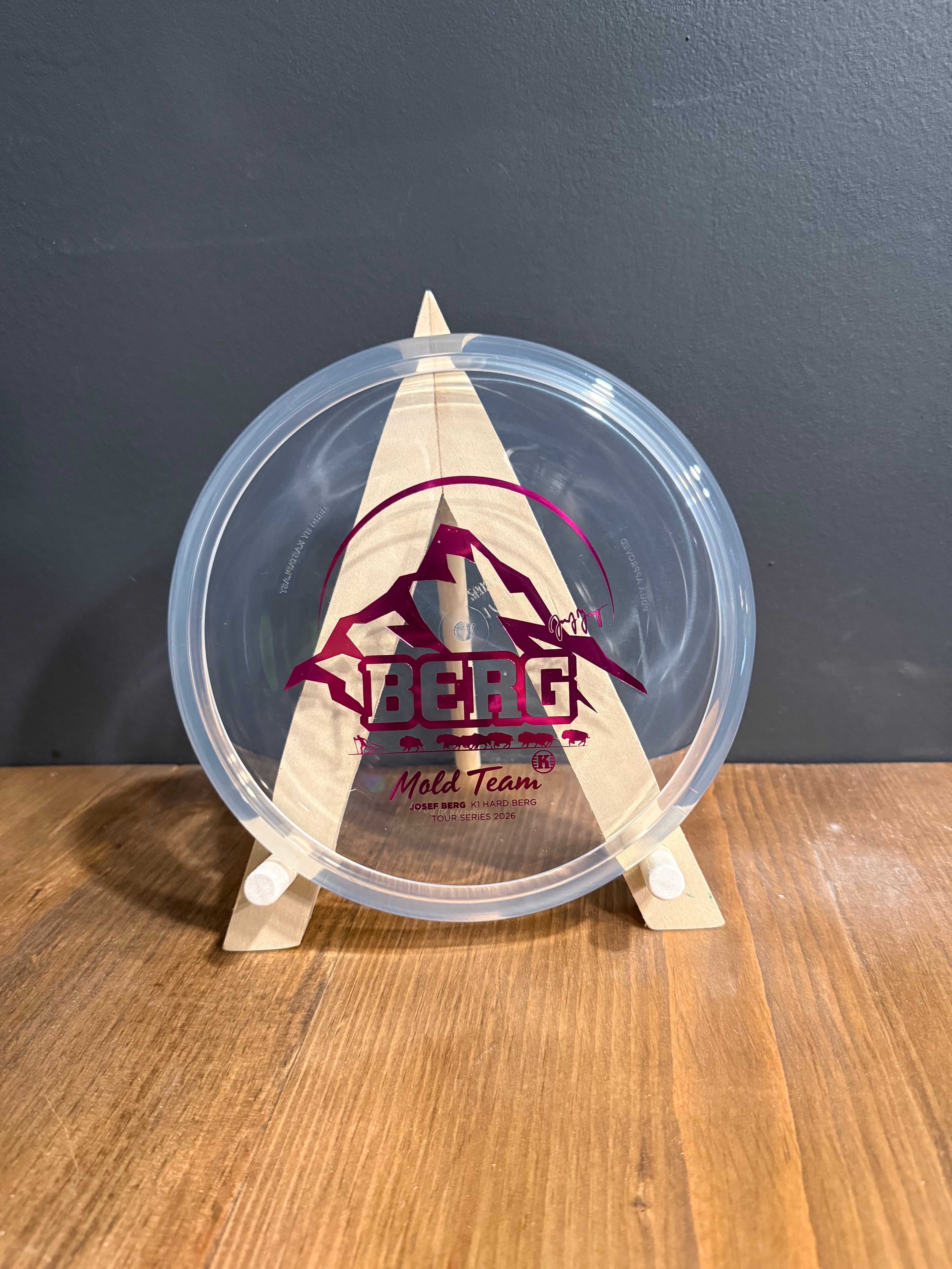 K1 Hard Berg clear disc with beige mountain artwork, burgundy graphics and Josef Berg Mold Team branding