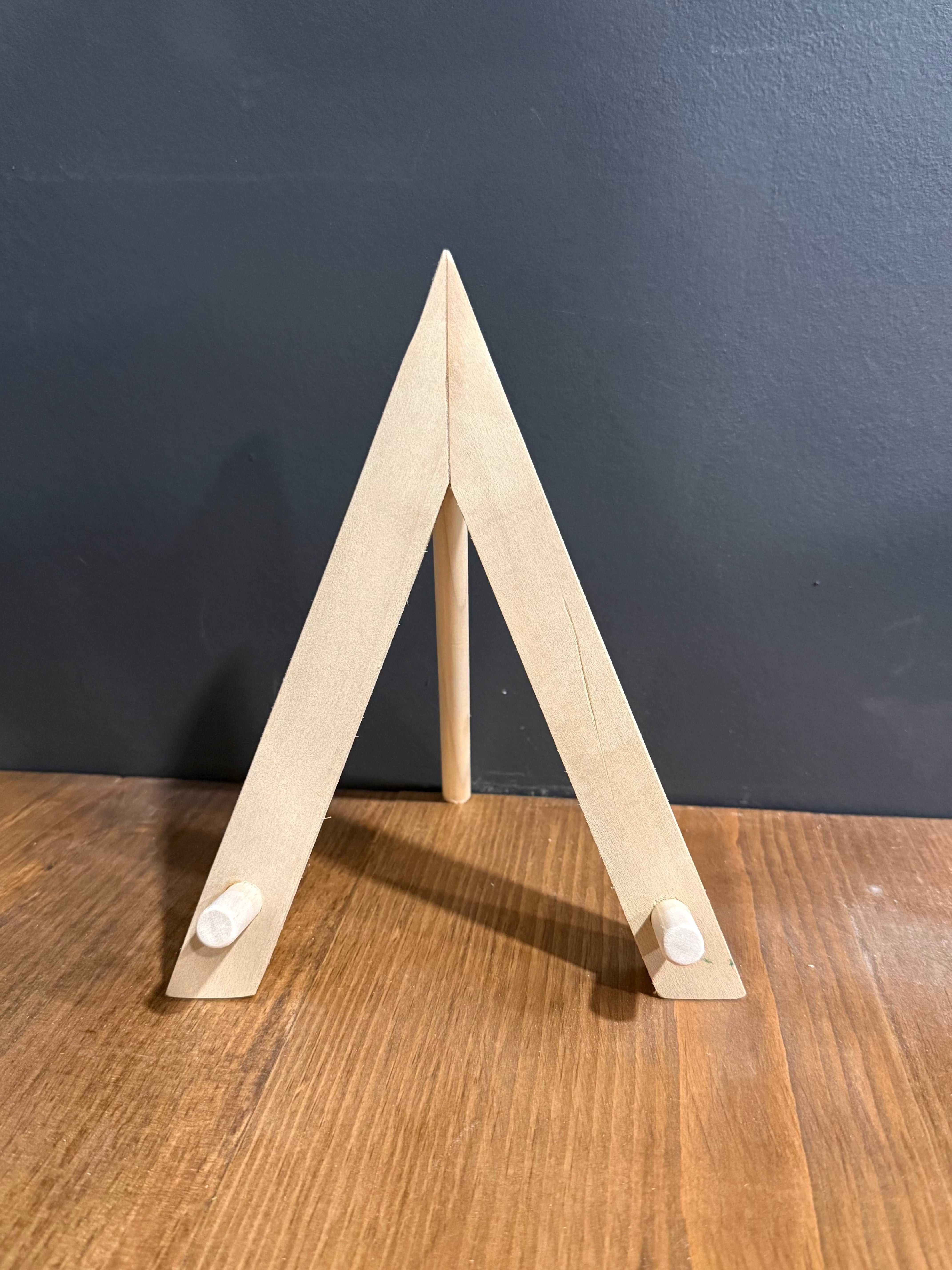 Handcrafted Wood Disc display stand in light natural wood, featuring an A-frame design with two angled supports.