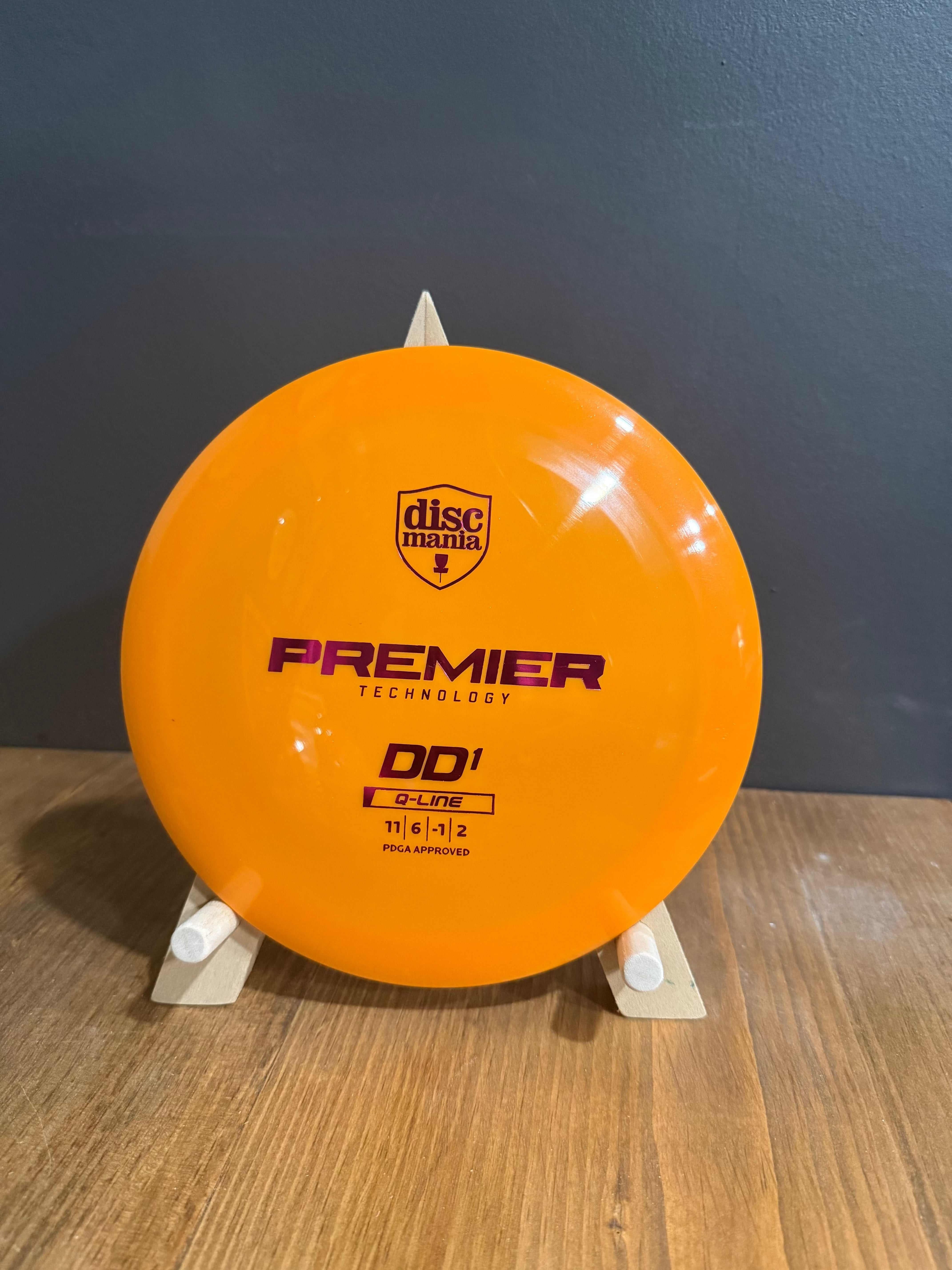 Q-Line Premier DD1 orange premium plastic distance driver with Discmania and Premier Technology branding