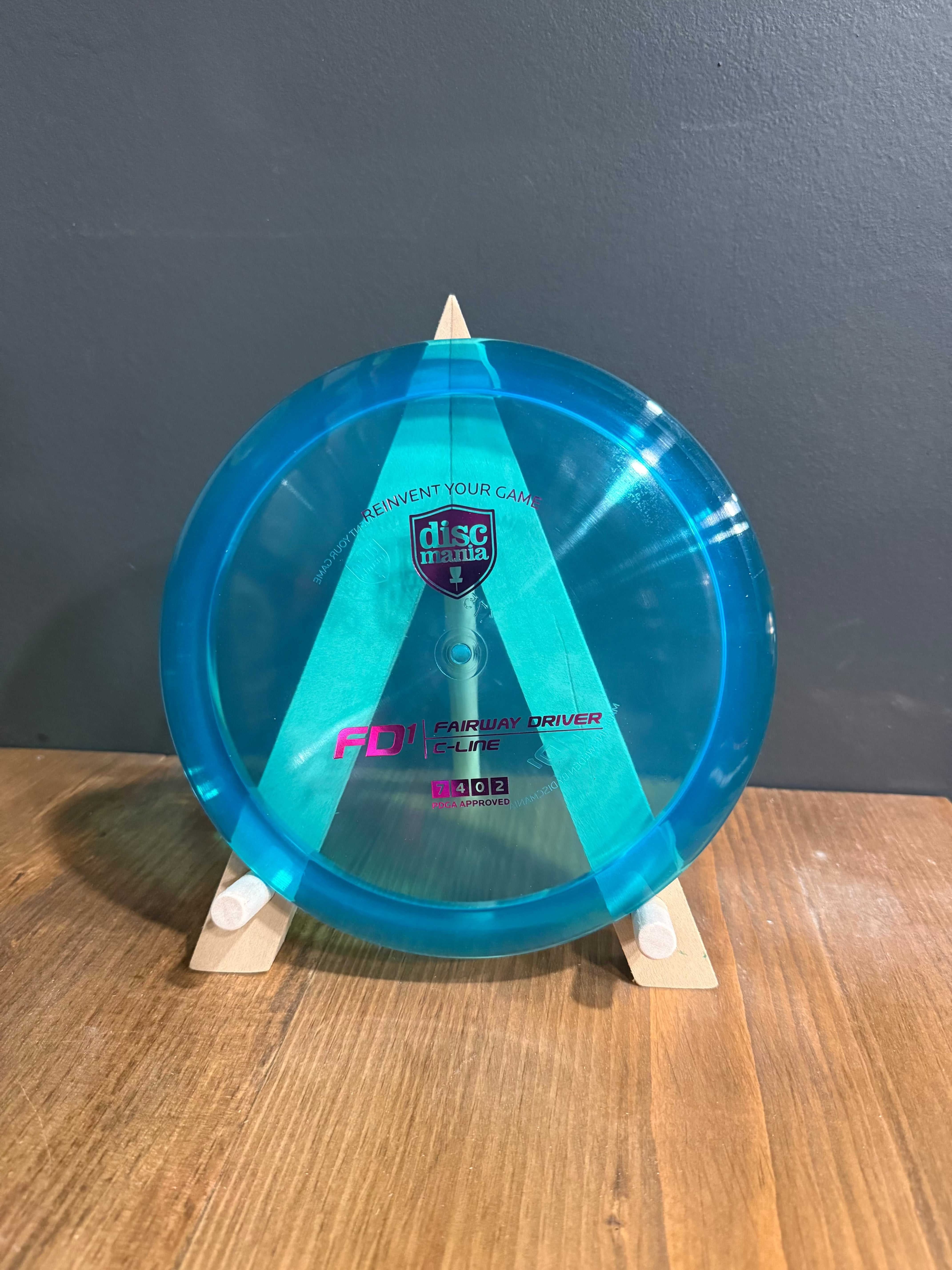 C-Line FD1 blue translucent plastic fairway driver with turquoise geometric stamp and pink lettering
