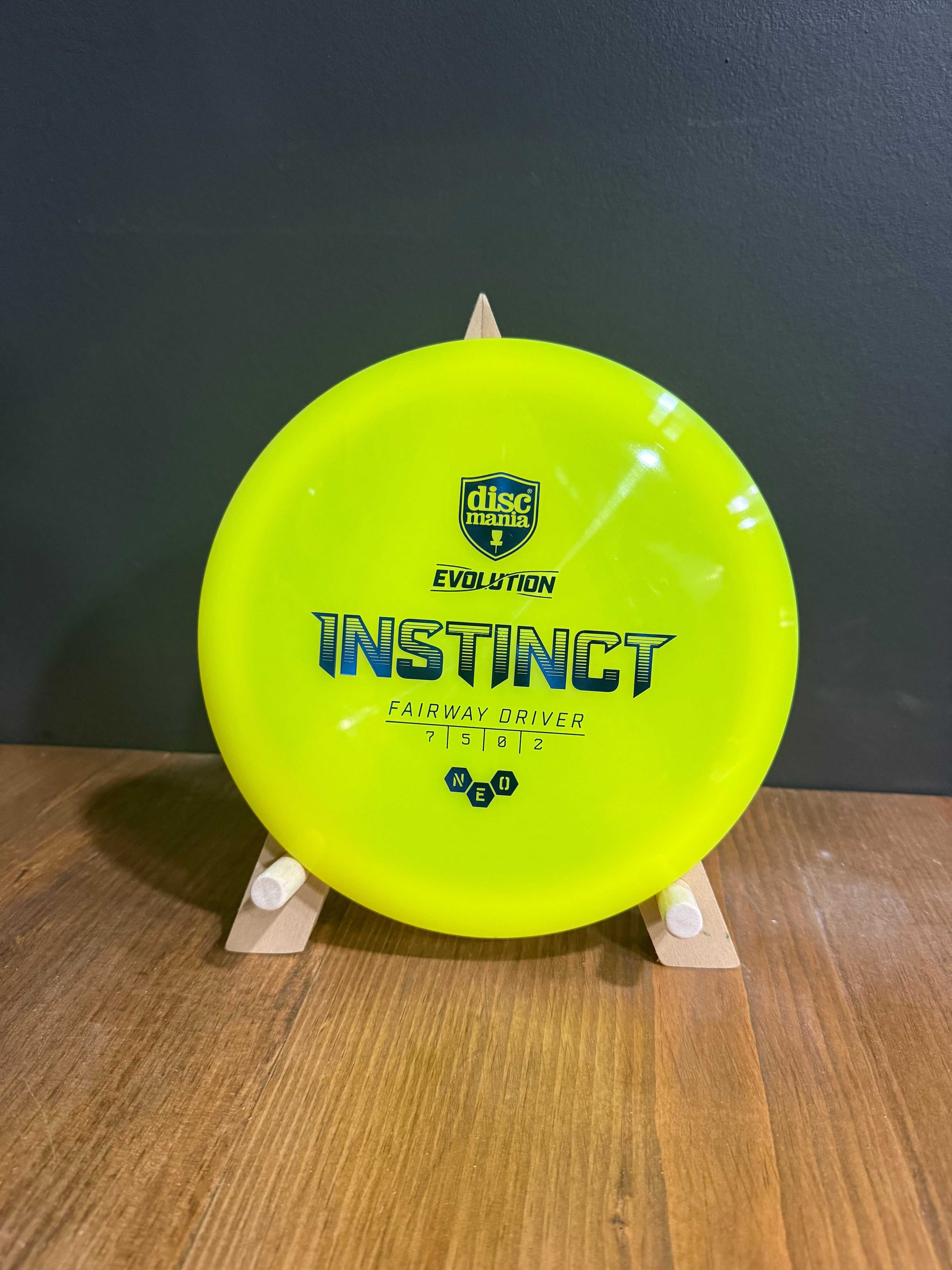 Neo Instinct fairway driver in bright neon yellow semi-translucent plastic with printed branding and flight numbers