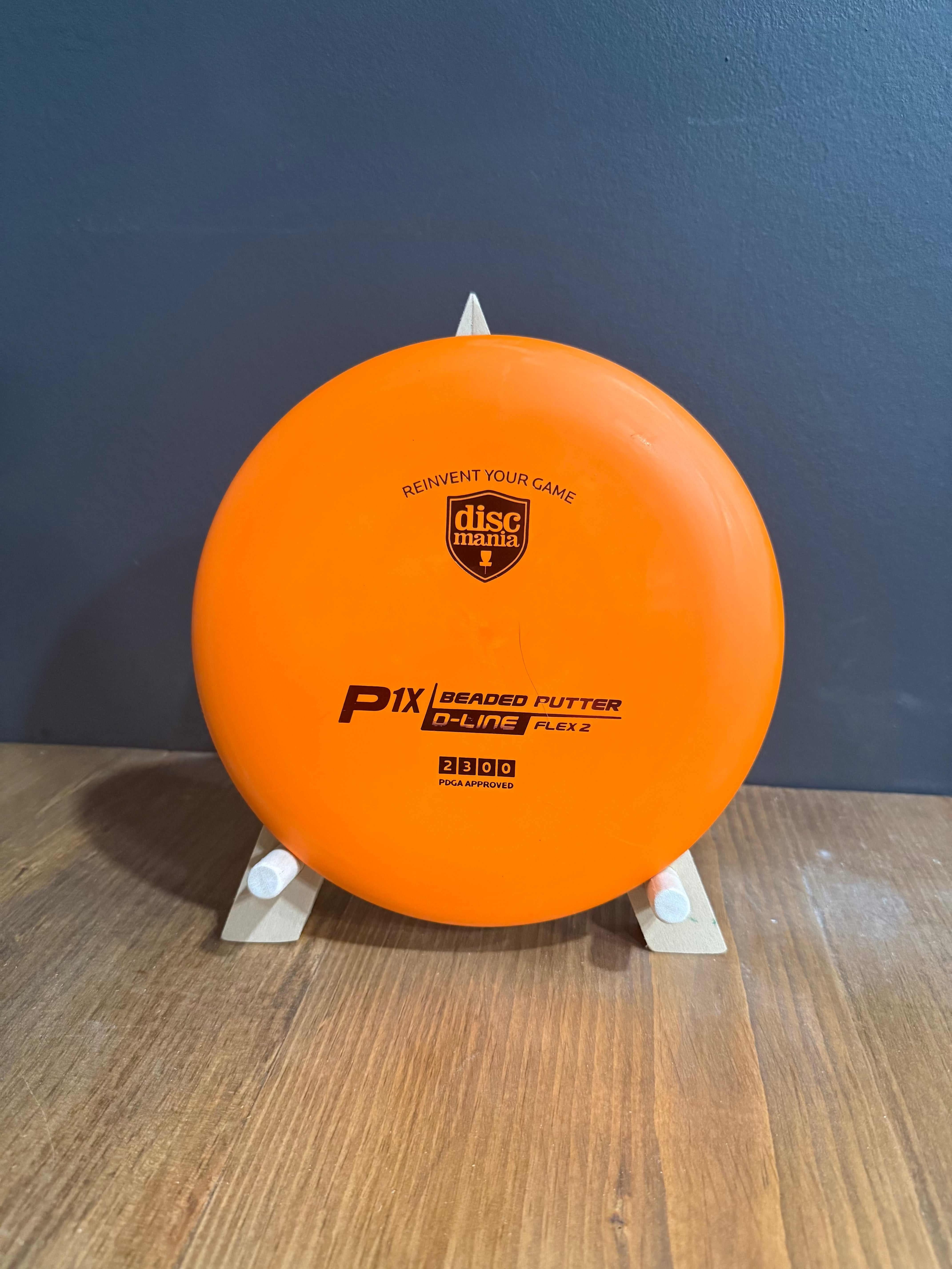 Flex 2 P-Line P1x orange beaded disc golf putter in flexible plastic with printed branding and flight numbers
