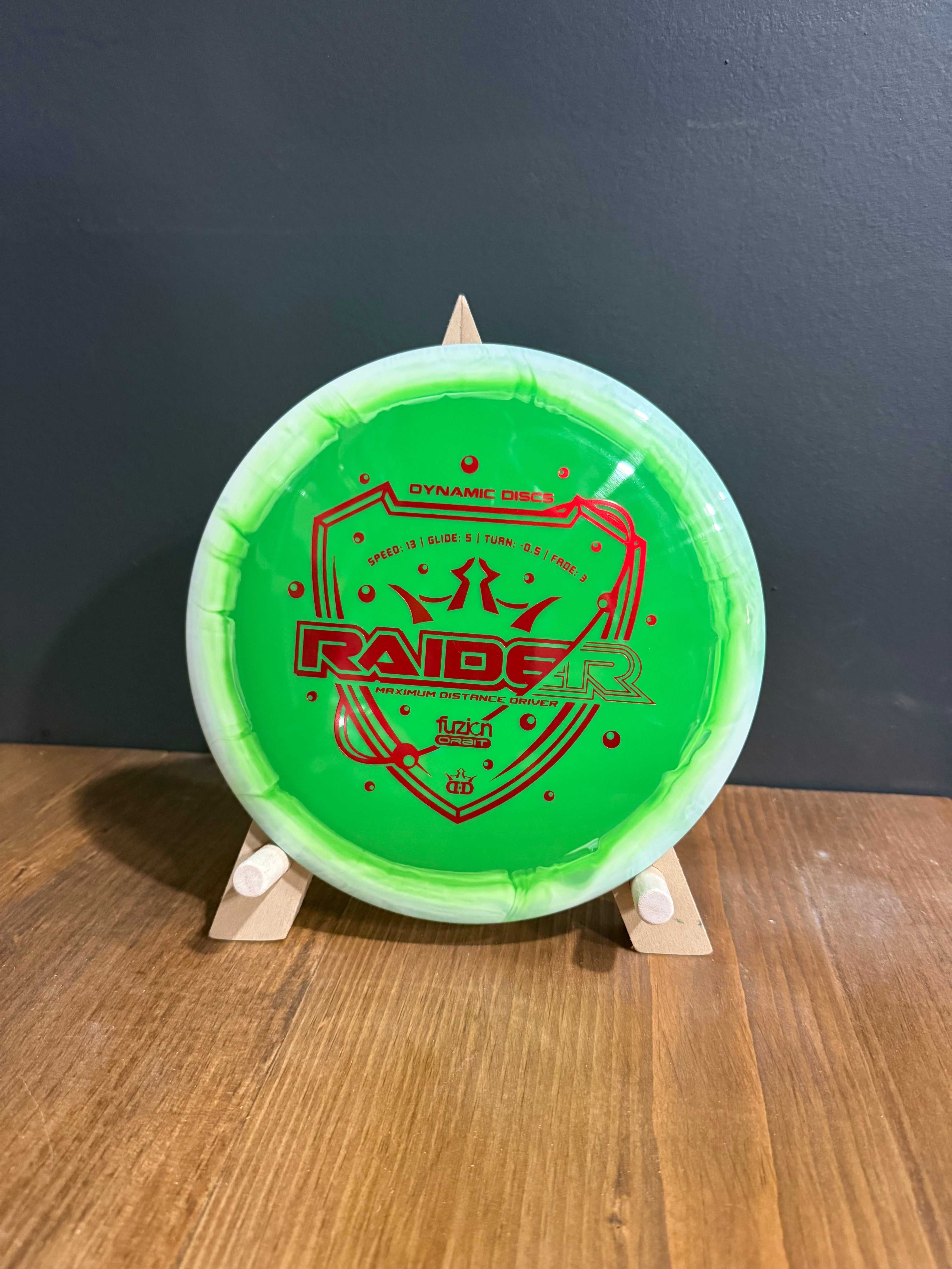 Fuzion Orbit Raider disc in bright neon green plastic with a red graphic and black lettering
